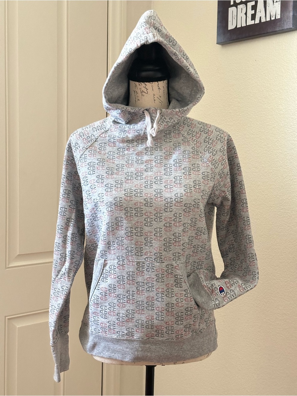 Champion hoodie with a repeating all-over logo